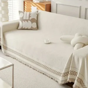 How to wash linen sofa covers showing a bright beige linen sofa neatly arranged with neutral cushions and a soft throw in a modern living room