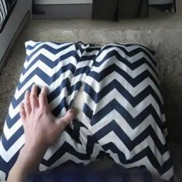 Custom zippered cushion with a modern design for easy maintenance.