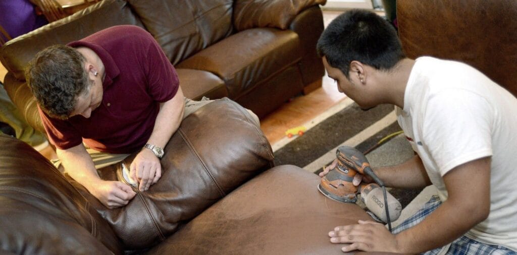 How to Repair Leather Sofa two professional repairing a leather sofa