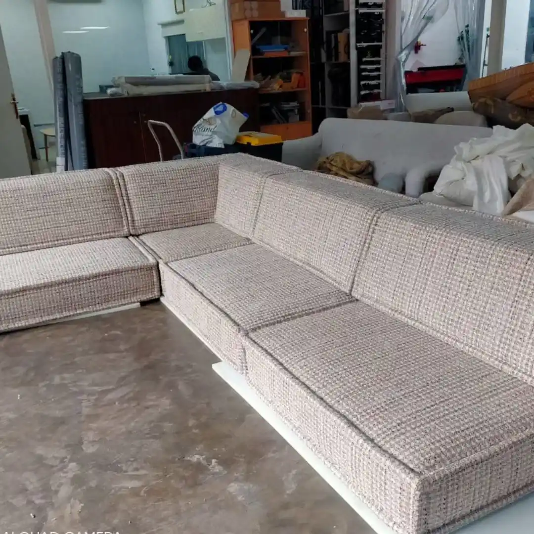 5 reasons why sofa upholstery is a smart investment, showcasing a newly reupholstered sofa with vibrant fabric and well-maintained cushions.