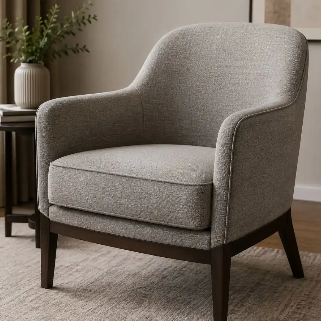 Why Chair Upholstery Is the Secret to elegant interiors featuring a modern upholstered chair with premium fabric and wooden legs.