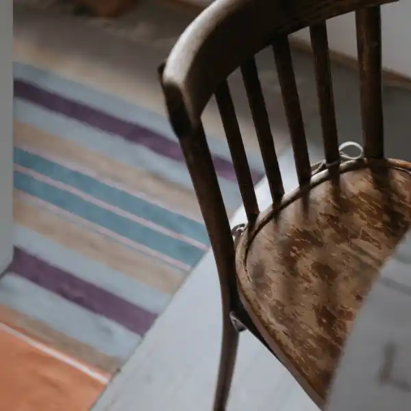 Old wooden dining chair before upholstery restoration in Dubai